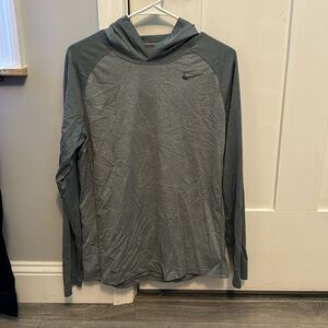 Men’s Nike brand long sleeve hooded shirt.  Silky material.  Size M